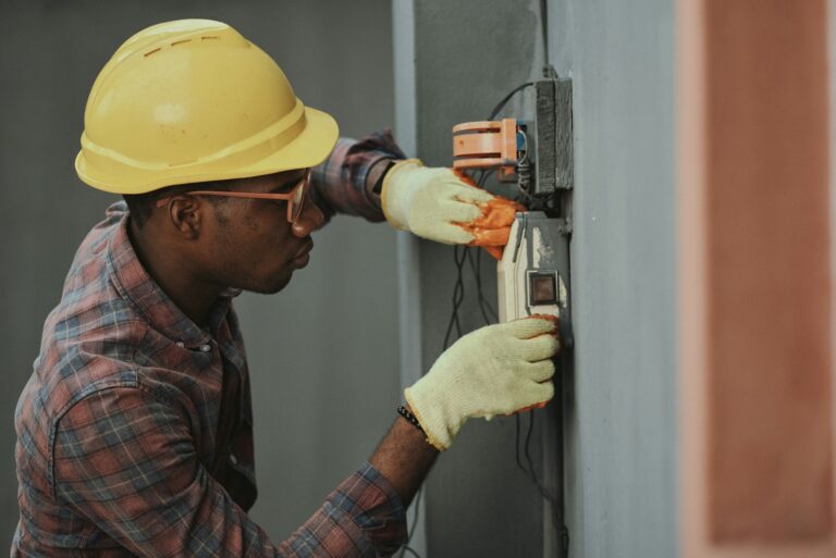 Electrician working on a service panel